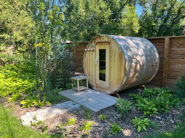 barrel sauna in backyard